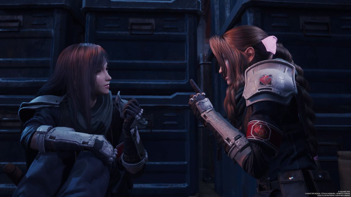 An image showing Tifa and Aerith having a private conversation in Final Fantasy 7 Rebirth.  They are in a dark room and lean in to talk to each other. 