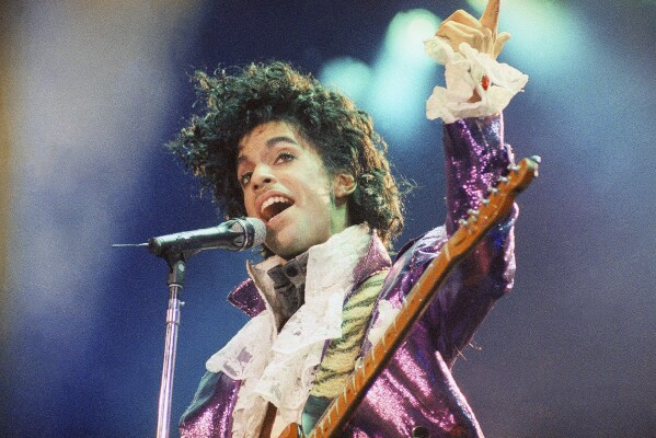 FILE - Prince performs at The Forum in Inglewood, California on February 18, 1985. Apple Music announced on Wednesday, May 22, 2024 its 10 greatest albums of all time and 