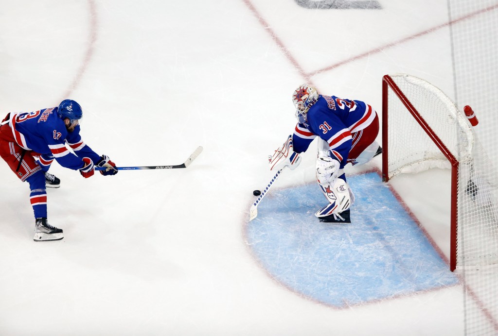 Alexis Lafrenière (left) accidentally puts the puck between the legs of his teammate, New York Rangers goaltender Igor Shesterkin, while trying to stop a shot from Florida Panthers center Carter Verhaeghe in the third period .