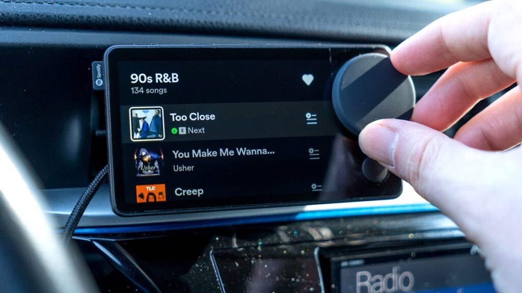 Turning the dial on Spotify Car Thing.