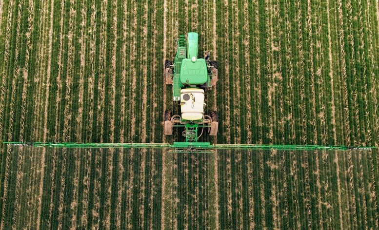 Mechanical sprays cover crops in a western Kentucky field