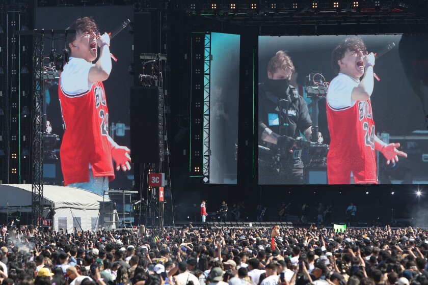 Xavi sings in front of hundreds of people at the Sueños Music Festival wearing a Bulls jersey