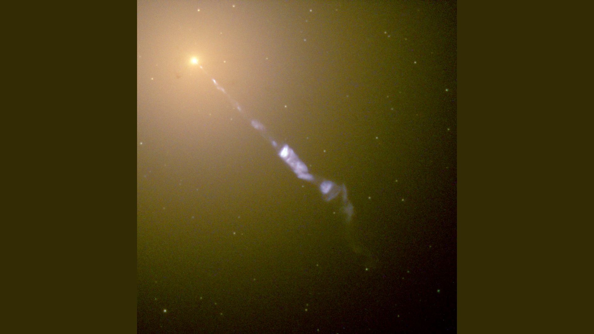     An image of a jet coming from the heart of a galaxy. 