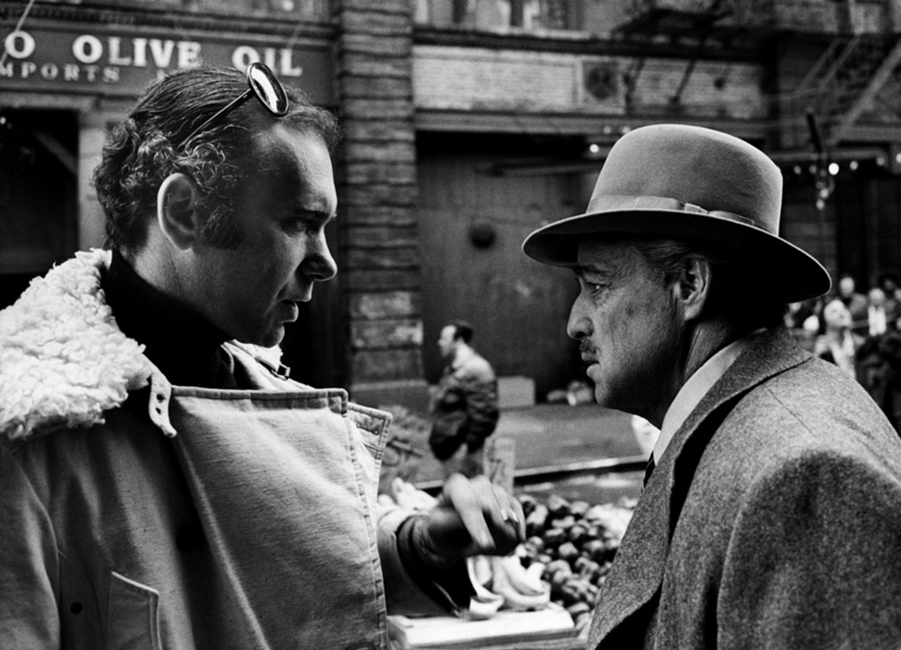 THE GODFATHER, producer Albert S. Ruddy, Marlon Brando, on set, 1972