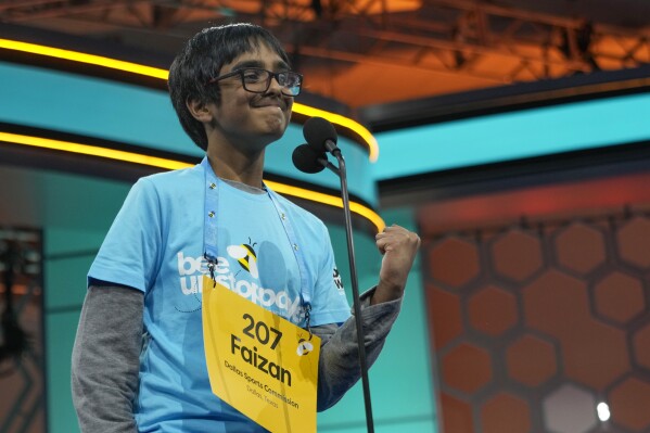 Faizan Zaki, 12, of Allen, Texas, competes in the finals of the Scripps National Spelling Bee, in Oxon Hill, Maryland, Thursday, May 30, 2024. (AP Photo/Jacquelyn Martin)