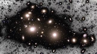 A manipulated image of the Perseus Cluster showing the cluster's two brightest galaxies, NGC 1275 (left) and NGC 1272 (right),