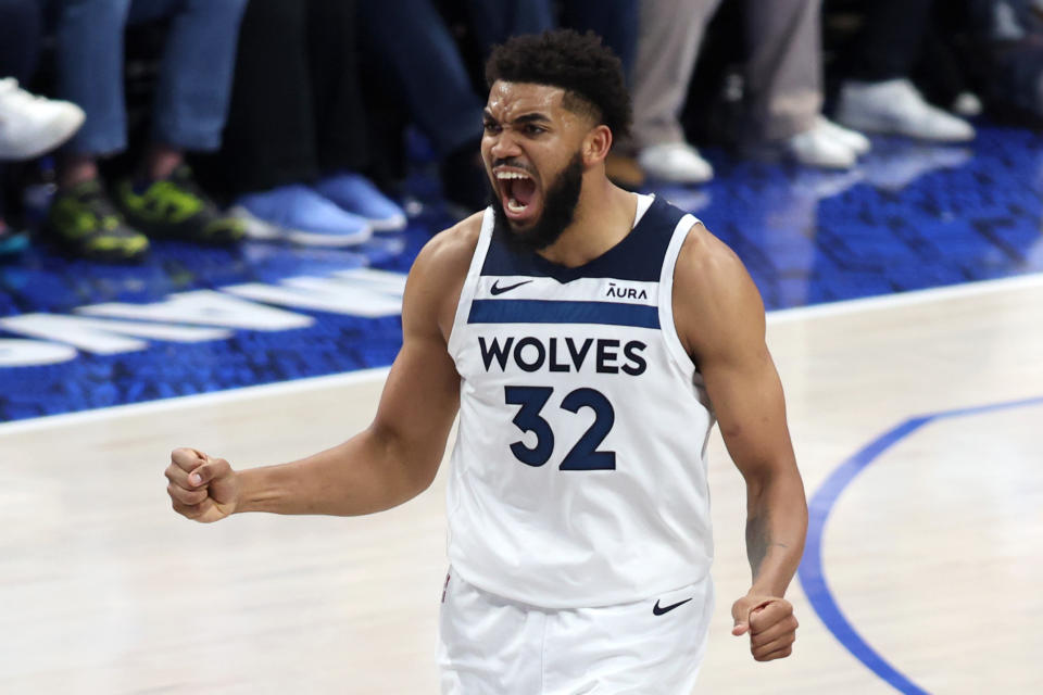 DALLAS, TEXAS - MAY 28: Karl-Anthony Towns #32 of the Minnesota Timberwolves celebrates a basket during the second half against the Dallas Mavericks in Game 4 of the Western Conference Finals at the American Airlines Center on May 28, 2024 in Dallas , Texas.  NOTE TO USER: User expressly acknowledges and agrees that by downloading and/or using this photograph, User consents to the terms and conditions of the Getty Images License Agreement.  (Photo by Tim Heitman/Getty Images)