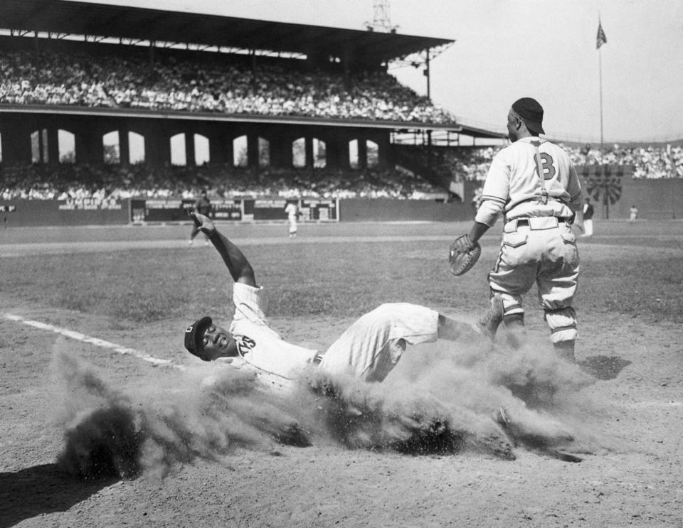 Josh Gibson returns home after being thrown out by catcher Ted Radcliffe during the Negro Leagues East-West All-Star Game at Comiskey Park in Chicago, August 13, 1944. (Getty Images)