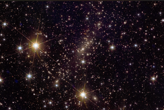 Another dark region of space with many light spots of different sizes.  Some larger ones towards the left and bottom of the image, and generally around, have visible diffraction spikes.