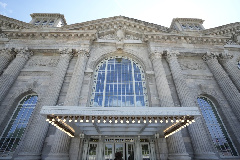 The entrance to Michigan Central Station is seen, Monday, May 13, 2024 in Detroit.  A once-imposing, scavenger-ravaged monolith that symbolized Detroit's decline reopens this week after a massive, six-year, multimillion-dollar renovation by Ford Motor Co. that restored Michigan's Central Station to its former grandeur with a focus on the future of mobility.  (AP Photo/Carlos Osorio)