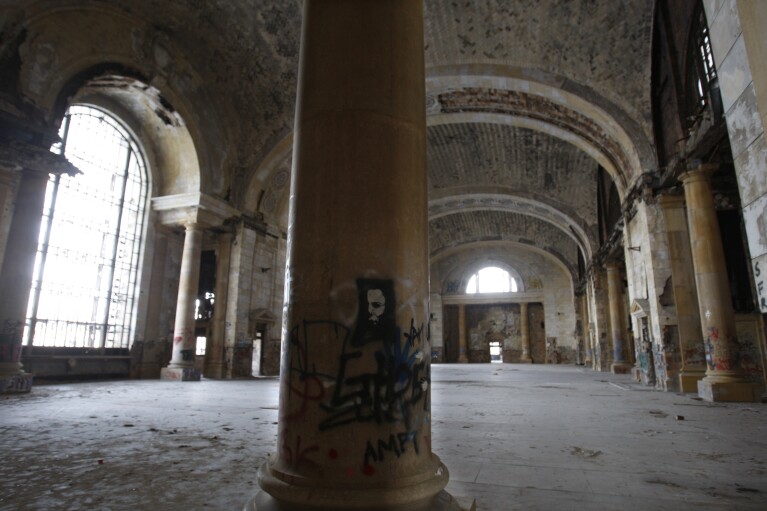 FILE- The interior of Michigan Central Station is seen Thursday, Jan. 21, 2010 in Detroit.  A once-imposing, scavenger-ravaged monolith that symbolized Detroit's decline reopens this week after a massive, six-year, multimillion-dollar renovation by Ford Motor Co. that restored Michigan's Central Station to its former grandeur with a focus on the future of mobility.  (AP Photo/Carlos Osorio_File)