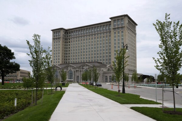 FILE- The exterior of Michigan Central Station is seen July 13, 2023 in Detroit.  A once-imposing, scavenger-ravaged monolith that symbolized Detroit's decline reopens this week after a massive, six-year, multimillion-dollar renovation by Ford Motor Co. that restored Michigan's Central Station to its former grandeur with a focus on the future of mobility.  (AP Photo/Carlos Osorio_File)