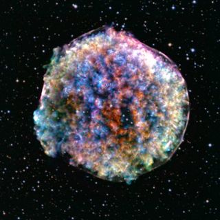 A blurry, multi-colored orb against a backdrop of star-studded space.