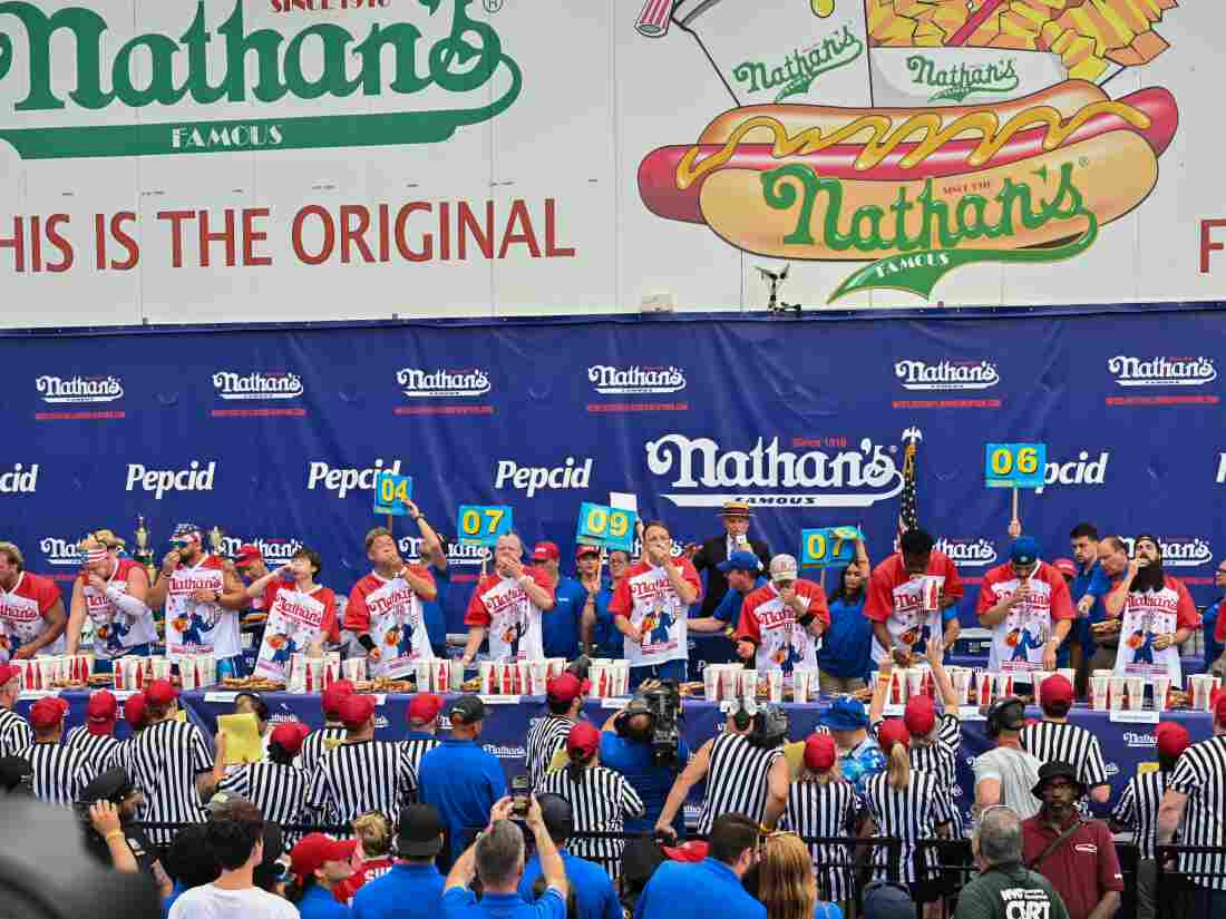 The men compete in Nathan's Famous July 4th, 2023 International Hot Dog Eating Contest.