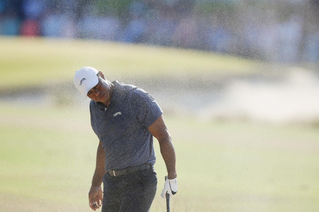 PINEHURST, NORTH CAROLINA - JUNE 14: Tiger Woods of the United States reacts after hitting from the rough on the 18th hole during the second round of the 124th U.S. Open at Pinehurst Resort on June 14, 2024 in Pinehurst, North Carolina.  (Photo by Alex Slitz/Getty Images)