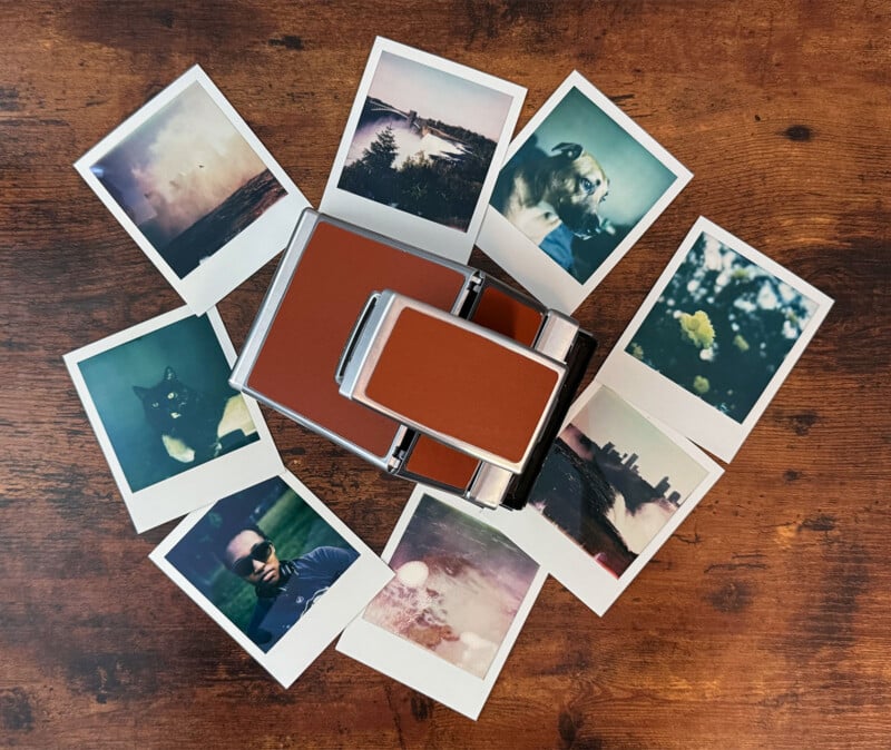 A vintage instant camera sits on a wooden surface, surrounded by nine Polaroid photos.  The images include nature scenes, a cat and a person wearing sunglasses, displaying a nostalgic and eclectic assortment of moments captured on film.