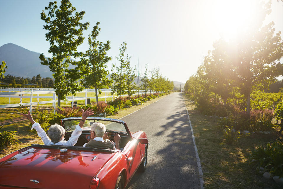 Photo of an elderly couple going on a road trip