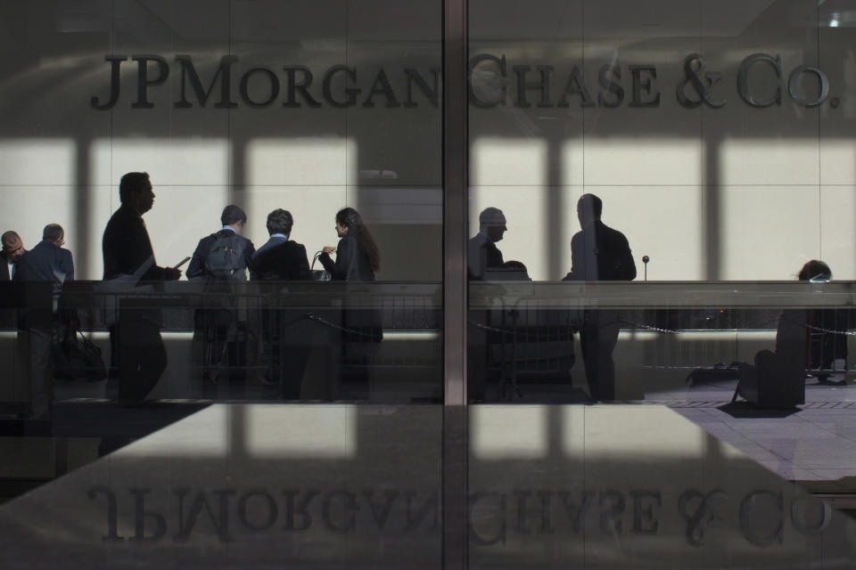 The lobby of JPMorgan's headquarters is pictured through its front doors in New York May 11, 2012. Stocks fell at the open on Friday after JPMorgan Chase & Co revealed a trading loss of at least 2 billion dollars following the failure of a hedging strategy, leading to a decline in bank stocks.  REUTERS/Eduardo Munoz (UNITED STATES - Tags: TPX BUSINESS IMAGES OF THE DAY)