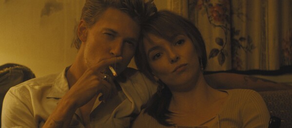 This image released by Focus Features shows Austin Butler, left, and Jodie Comer in a scene from 