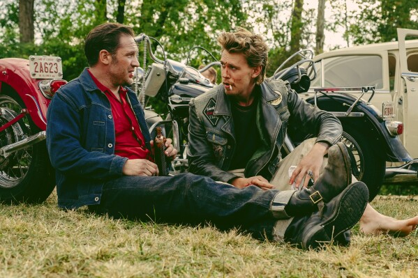 This image released by Focus Features shows Tom Hardy, left, and Austin Butler in a scene from 