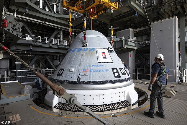 Starliner is lifted at the Space Launch Complex-41 Vertical Integration Facility at the Cape Canaveral Space Station in Florida, April 16, 2024.