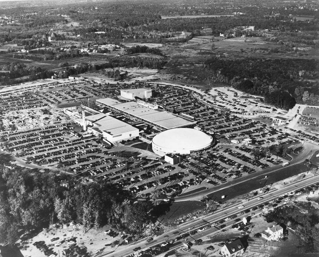 Aerial view of Shoppers World and its crowded parking lots in Framingham, Massachusetts, 1958. The mall was one of the first enclosed suburban shopping centers in the United States.