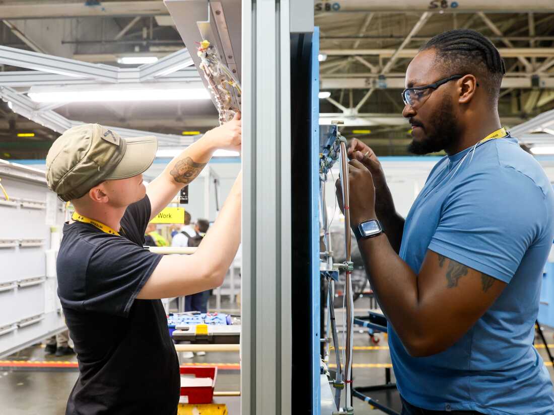 “Every bolt, every washer, every rivet.  It all matters,” said Derrick Farmer, right, while training on electrical systems with Timothy Well at the Boeing Basic Training Center on Tuesday.