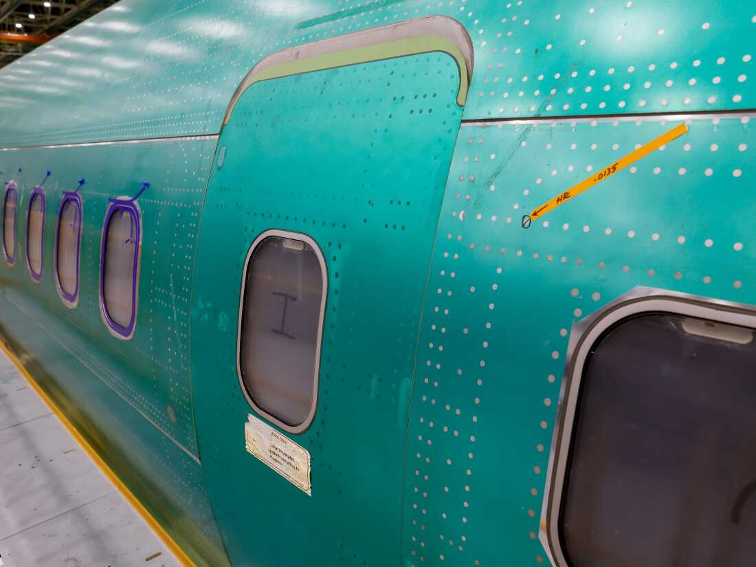 A mid-cabin door plug is visible Tuesday on a 737 MAX airplane at the Boeing 737 factory in Renton, Washington.