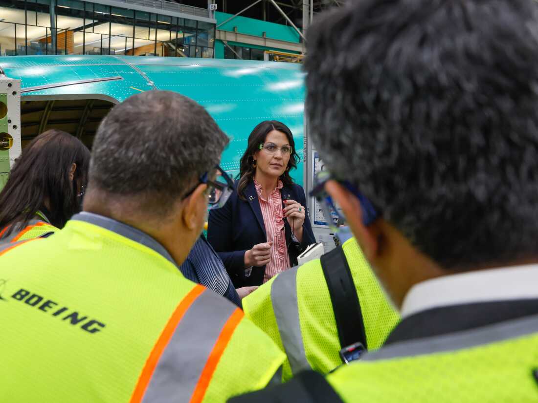 Katie Ringgold, vice president and general manager of the 737 program, speaks to media gathered at the Boeing 737 factory.