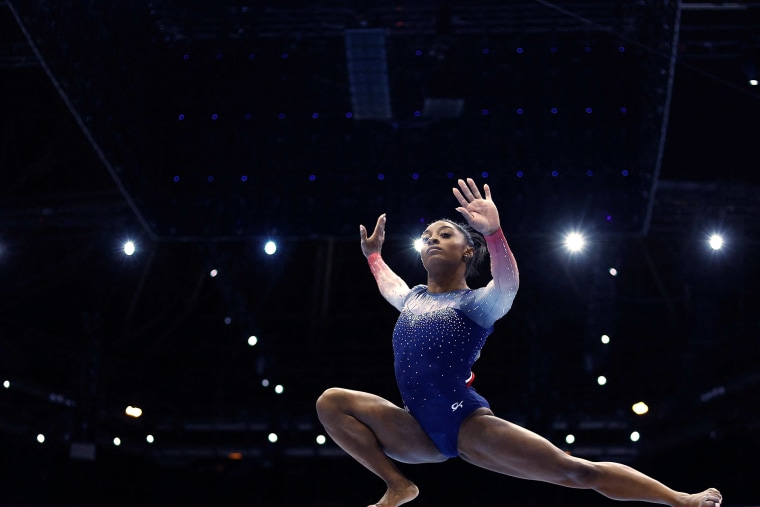 Simone Biles competes on beam