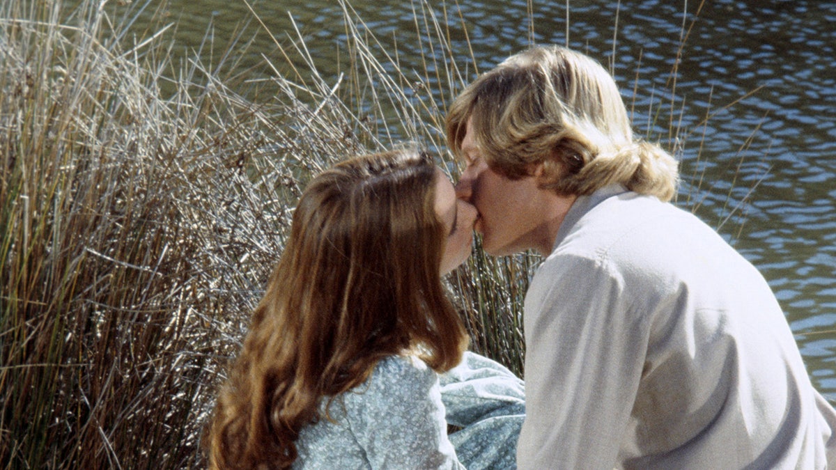 Melissa Gilbert kisses Dean Butler.