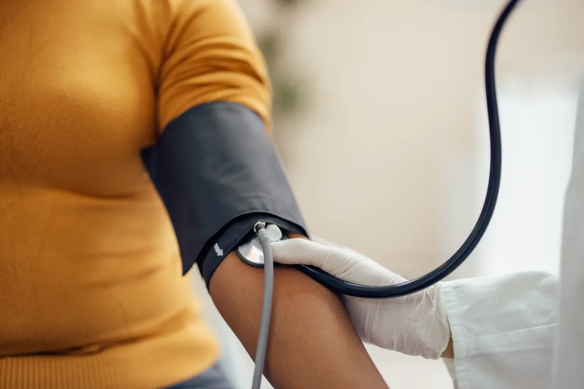 Measuring blood pressure with a manometer, a sphygmomanometer.