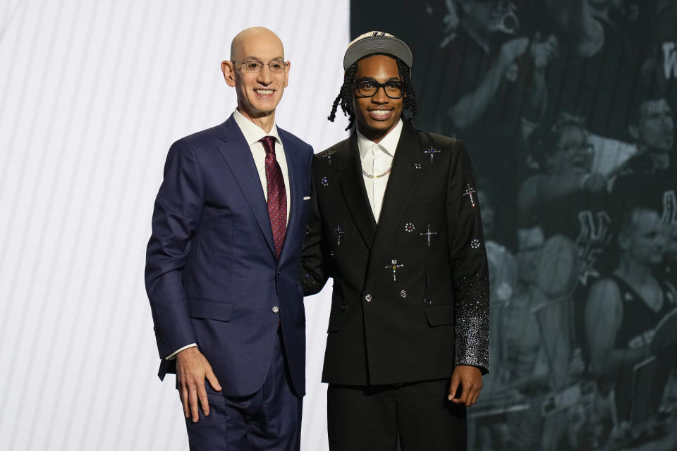 Rob Dillingham, right, poses for a photo with NBA Commissioner Adam Silver after being selected by the San Antonio Spurs in the first round of the NBA basketball draft, Wednesday, June 26, 2024, in New York.  (AP Photo/Julia Nikhinson)