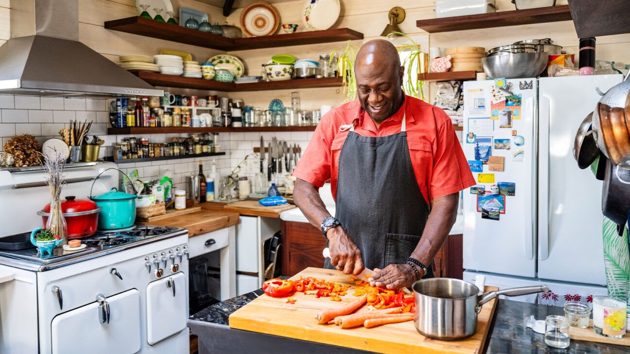 A man cooking in a kitchen.