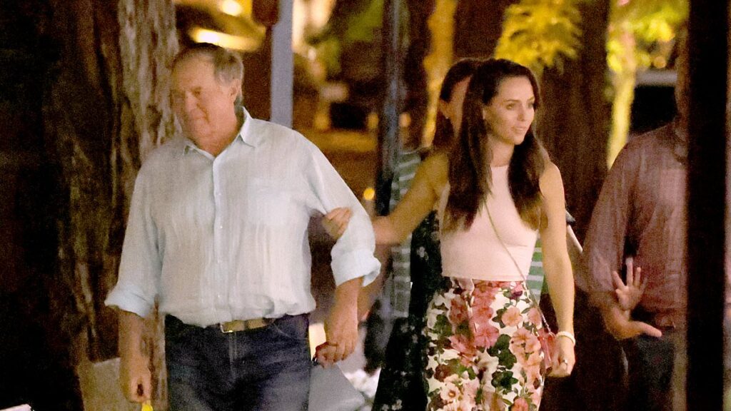 Bill Belichick and his girlfriend, 24, hug during a date in Nantucket