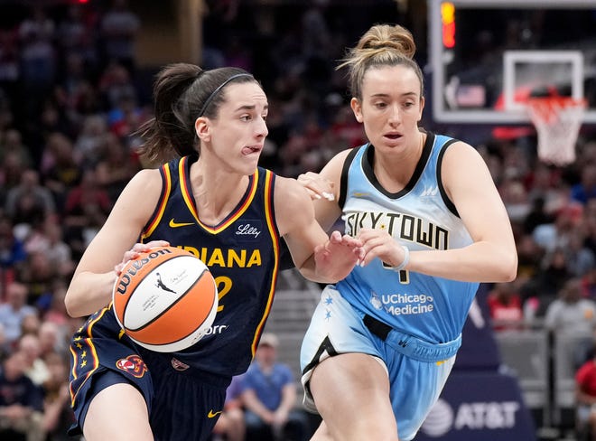 Indiana's Caitlin Clark drives to the basket against Chicago's Marina Mabrey during the first half.