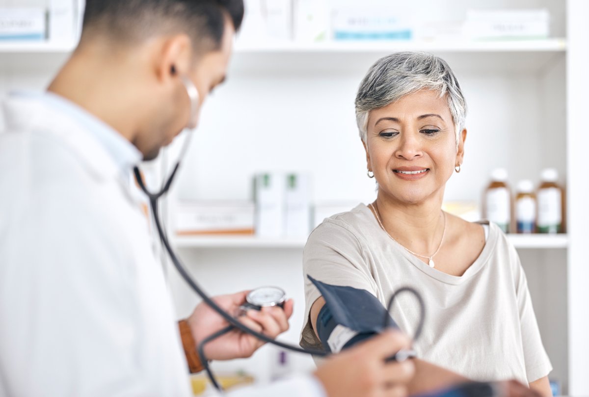 Woman having her blood pressure checked