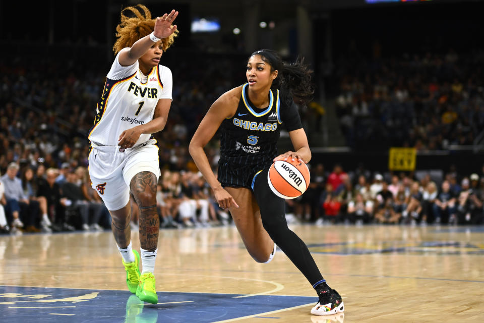 CHICAGO, ILLINOIS - JUNE 23: Angel Reese #5 of the Chicago Sky drives with the basketball in the first half against NaLyssa Smith #1 of the Indiana Fever at Wintrust Arena on June 23, 2024 in Chicago, Illinois.  NOTE TO USER: User expressly acknowledges and agrees that by downloading and/or using this photograph, User consents to the terms and conditions of the Getty Images License Agreement.  (Photo by Quinn Harris/Getty Images)