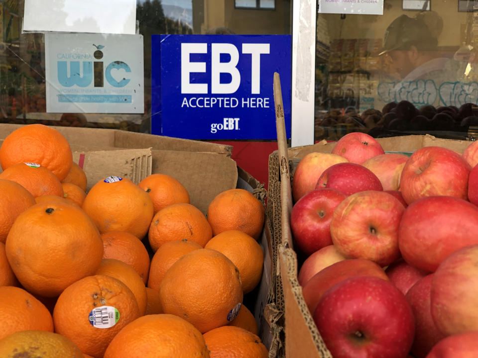 OAKLAND, CALIFORNIA - DECEMBER 04: A sign indicating acceptance of Electronic Benefit Transfer (EBT) cards used by state social services to issue benefits is displayed at a grocery store on December 04, 2019 in Oakland, California.  Nearly 700,000 people are set to lose their food stamp benefits after the Trump administration announced plans to reform the Supplemental Nutrition Assistance Program, or SNAP.  (Photo by Justin Sullivan/Getty Images)