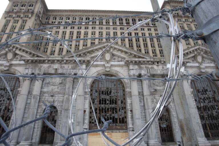 FILE- The abandoned Michigan Central Station is seen Thursday, January 21, 2010 in Detroit.  A once-imposing, scavenger-ravaged monolith that symbolized Detroit's decline reopens this week after a massive, six-year, multimillion-dollar renovation by Ford Motor Co. that restored Michigan's Central Station to its former grandeur with a focus on the future of mobility.  (AP Photo/Carlos Osorio_File)