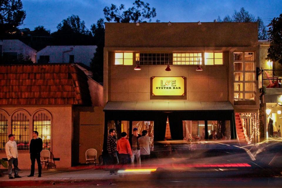 An exterior of the L&E Oyster Bar at night