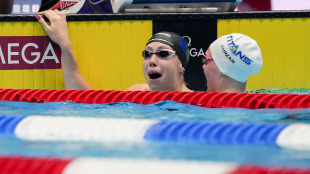 Gretchen Walsh reacts after setting a world record during the 100 meter butterfly semi-finals at the US Olympic Trials.