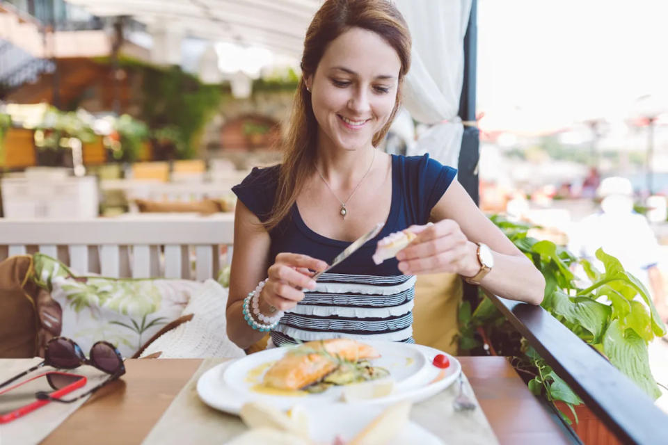 Woman eating seafood