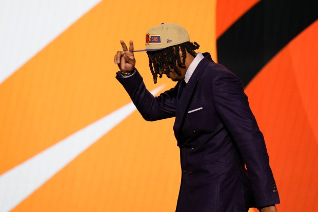 DaRon Holmes II reacts as he takes the stage after being selected 22nd by the Phoenix Suns in the first round of the NBA basketball draft, Wednesday, June 26, 2024, in New York.  (AP Photo/Julia Nikhinson)