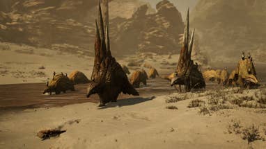 A herd of four-legged spiny creatures walking across a river bed in Monster Hunter Wilds