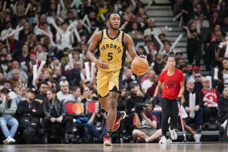 TORONTO, ON - APRIL 7: Immanuel Quickley #5 of the Toronto Raptors dribbles against the Washington Wizards during the second half of their basketball game at Scotiabank Arena on April 7, 2024 in Toronto, Ontario, Canada.  NOTE TO USER: The user expressly acknowledges and agrees that by downloading and/or using this photograph, he or she consents to the terms and conditions of the Getty Images License Agreement.  (Photo by Mark Blinch/Getty Images)