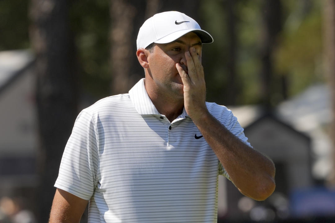 Scottie Scheffler reacts after missing a putt on the second hole during the second round of the U.S. Open golf tournament, Friday, June 14, 2024, in Pinehurst, N.C. (AP Photo/Matt York)