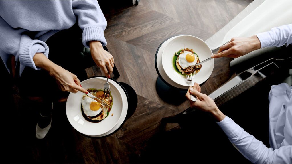 two dishes with fried eggs seen from above