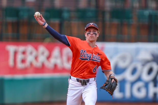 Virginia infielder Griff O'Ferrall (6) warms up before an NCAA baseball game against Wichita State, Friday, Feb. 23, 2024, in Jacksonville, Fla. (AP Photo/Gary McCullough)