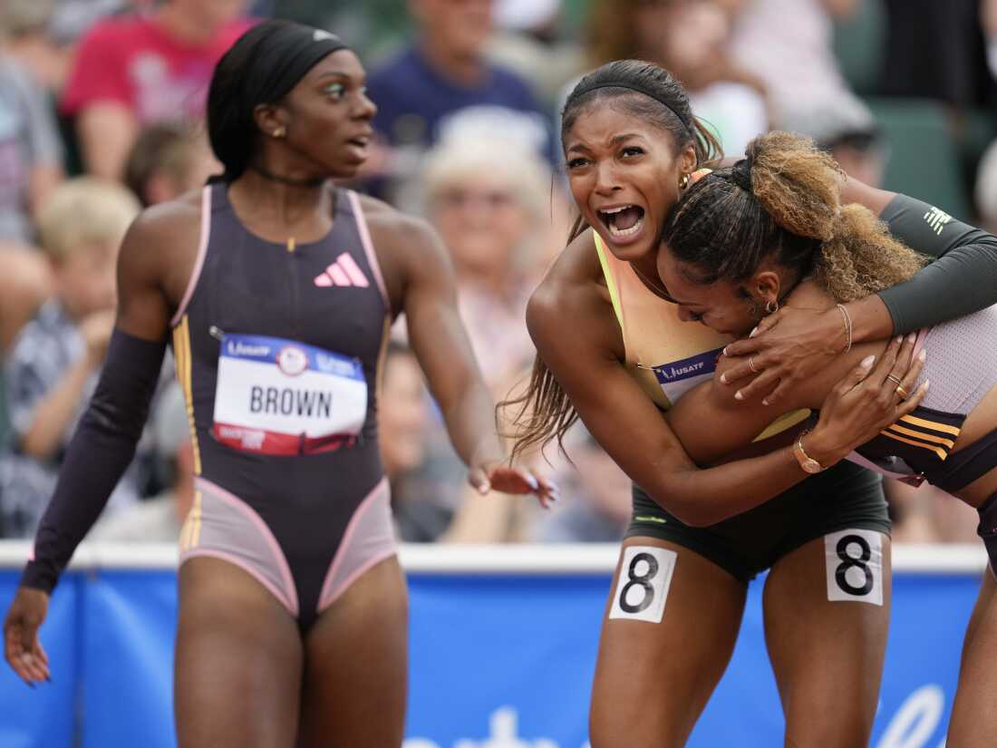 Gabby Thomas celebrates after winning the women's 200 meters final with third-place finisher McKenzie Long during the U.S. Olympic Team Trials in track and field, Saturday, June 29, 2024, in Eugene, Ore. 